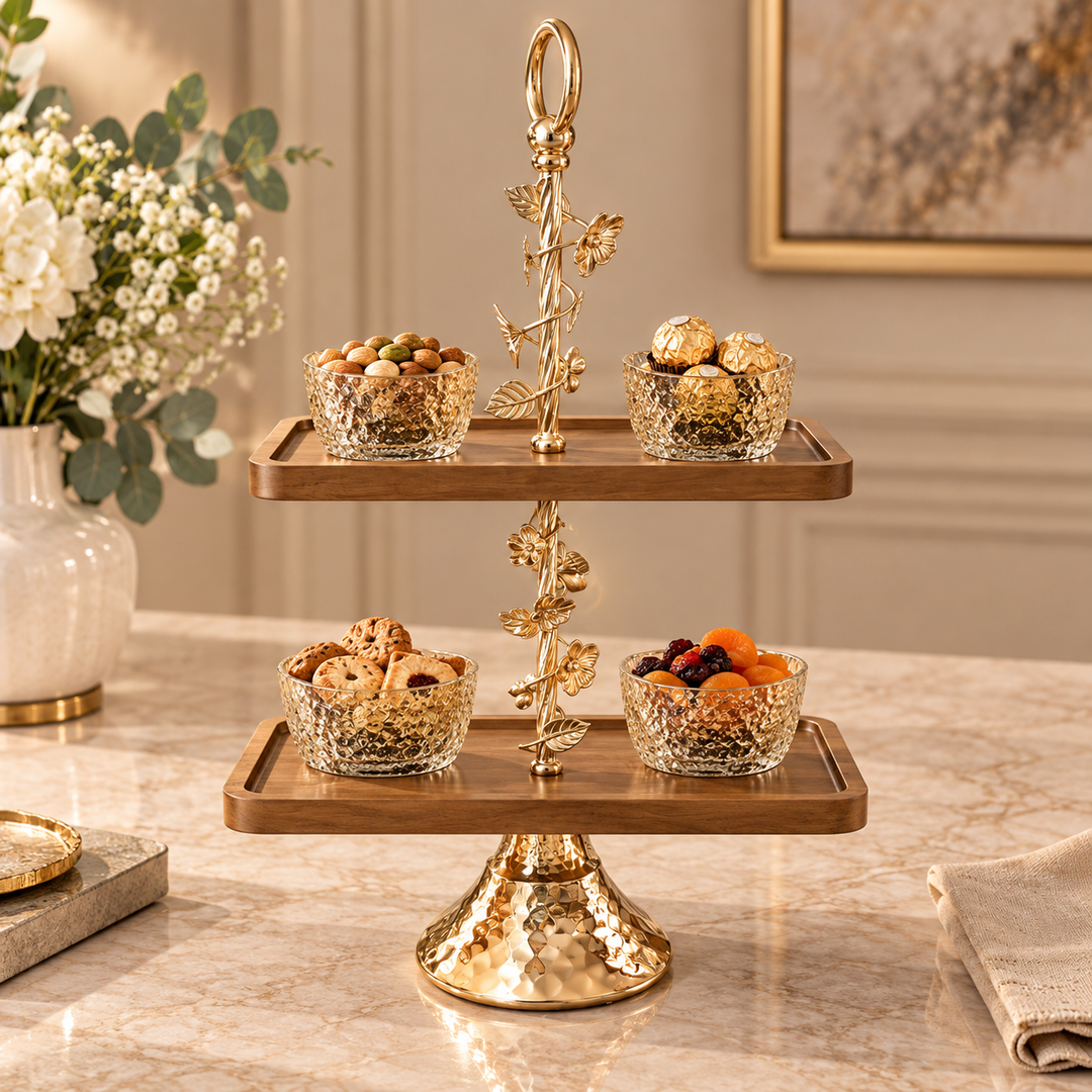 Gold vine two-tier serving stand with wooden trays holding sweets and dry fruits